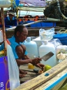 ::making us a fresh coconut shake on the boat::