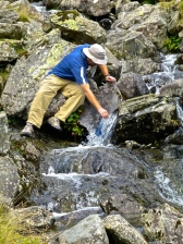::look at my resourceful man, refilling our water from the creek::